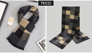 Detail of plaid wool scarf with fringes and logo tag in black grey and khaki