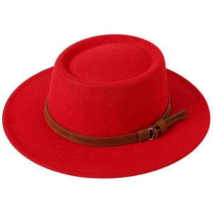 Top view of bright red wool fedora with wide brim and brown leather band detail