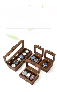 Top view of wooden texture watch storage boxes with clear windows and metal clasps