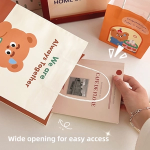 Detailed view of cute cartoon bear gift bag with paper texture and wide opening