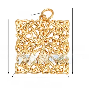 Macro shot of 21mm hollow square brass pendant with intricate mesh lace pattern