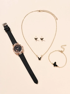 Detail of elegant black butterfly watch set including gold necklace and bracelet set