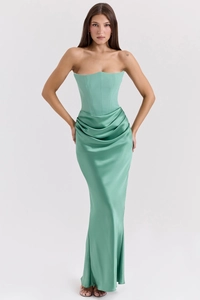 Detail showing the boned corset bodice and elegant satin draping on the mint green gown
