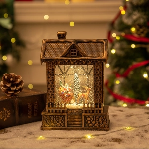 Christmas lantern house with Santa and reindeer scene, warm LED glow decoration