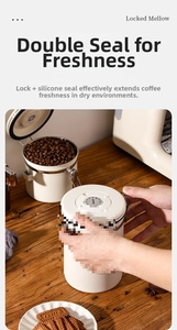 Detail of white airtight coffee canisters with date tracker and metal locking clamp