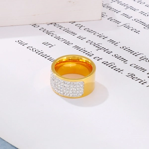 Detail of 18k gold plated stainless steel wide ring with rows of white pavé crystals