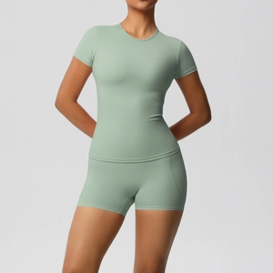 Detailed view of Morandi green brushed nylon yoga set with slim-fit tee and high-waist shorts