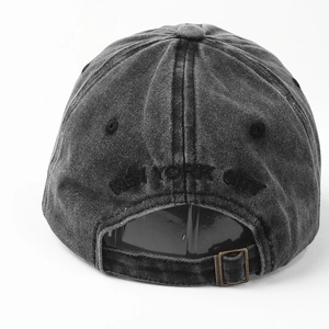 Detail view of washed denim baseball cap with New York City embroidery and metal buckle