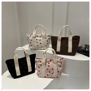 Corduroy strawberry print handbags in white, brown, black and pink colors