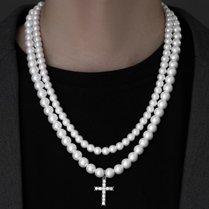 Double-layer pearl necklace with a sparkling rhinestone cross pendant on male model