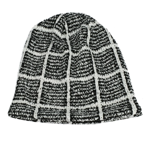 Winter knit beanie featuring a classic black and white checkerboard pattern in thick wool