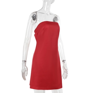 Detailed close-up of the red satin strapless mini dress on a display mannequin