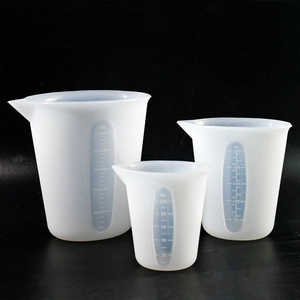 Three silicone measuring cups with scales and spouts in 500ml, 250ml, and 100ml sizes