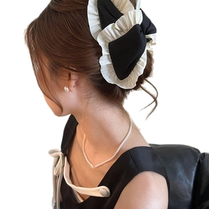 French vintage fabric pleated hair claw clip in black and white with ruffled bow edge