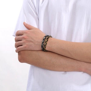 Detail of male model wearing dual-tone stainless steel hip hop chain bracelets set