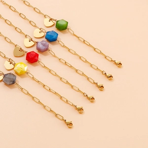 Set of 6 gold stainless steel bracelets with colorful beads and heart charms