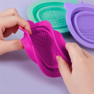 Silicone makeup brush cleaner bowl set in pink green and purple with multi-textured base