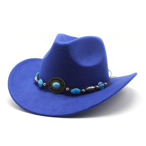 Detail of blue felt cowboy hat featuring ethnic decorative band with turquoise beads