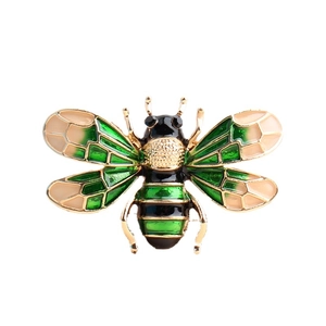 Exquisite gold bee brooch with green enamel wings and crystal rhinestone accents