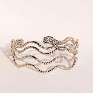 Silver multi-layer wavy open cuff bracelet with unique tiered flowing line design