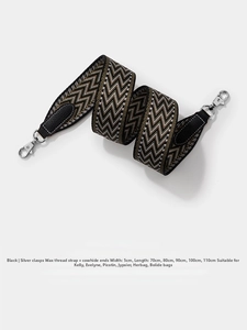 Close-up of 5cm wide wave pattern woven strap with leather ends and silver metal clips