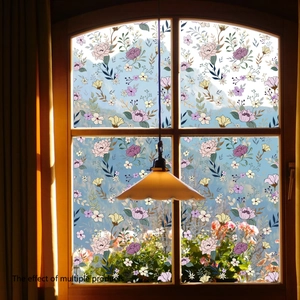 Floral window static film with pink and purple flowers on wooden window panes
