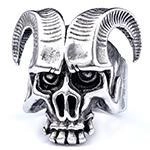 Macro detail of vintage punk gothic ram skull ring in aged silver finish stainless steel