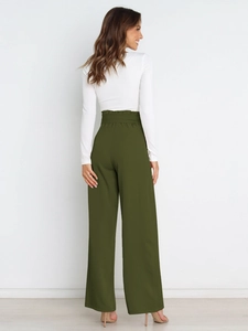 Detail of high-waisted olive green wide-leg pants with paper-bag waist and back tailoring