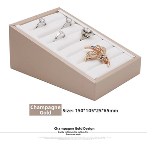 Champagne gold PU leather stepped jewelry display stand with dimensions 150x105x65mm