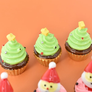 Detailed view of Christmas tree cupcakes miniatures with stars for holiday decor