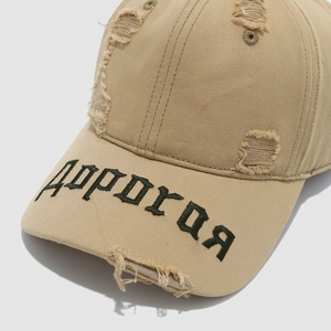 Distressed khaki kids baseball cap with vintage embroidery and worn-out canvas texture