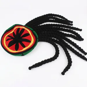 Knitted reggae beret with black dreadlocks in red yellow and green stripe pattern