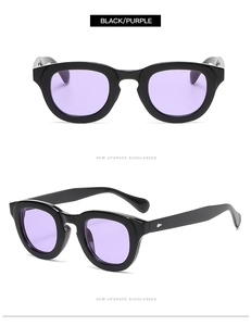 Close-up of retro round sunglasses featuring thick black frames and purple lenses