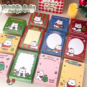 Overhead view of assorted cartoon dog Christmas packaging cards with festive motifs