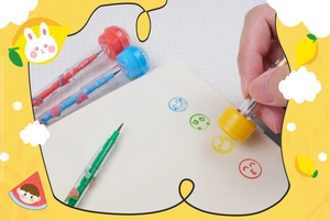 Detail view of colorful multi-functional pencils showing stamps and cute cartoon peach prints
