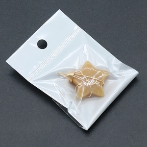 Natural yellow crystal star pendant wrapped in gold wire with a minimalist design