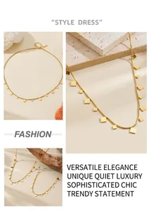 Detail shot of gold geometric pendant necklace featuring circle and square charms