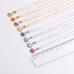 Eight minimalist oval starburst evil eye necklaces in gold and silver stainless steel