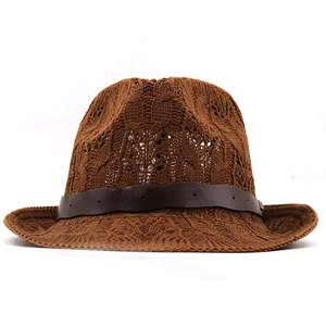 Macro shot of brown handwoven sun hat featuring detailed texture and a leather band