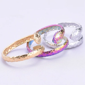 Adjustable snake rings in gold, rainbow and silver finishes with textured scale details