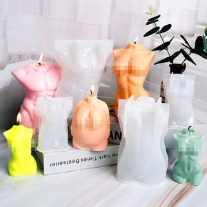 Detail of DIY silicone molds and finished colorful human torso aromatherapy candles