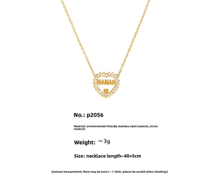 Detailed view of heart necklace with MAMAN engraving and zircon inlay on gold finish