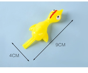 Detailed view showing the yellow finger slingshot chicken toy dimensions 9cm by 4cm