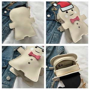 Detail view of ginger man crossbody bag showing back, front, side and inner zipper space