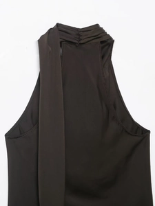 Close-up of halter neck pleated detail on dark brown satin texture sleeveless top