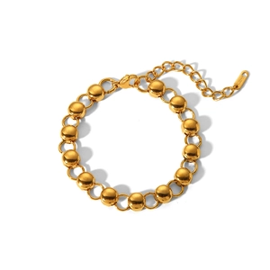 Close-up of golden stainless steel bead bracelet with lobster clasp and S.STEEL tag
