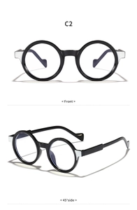 Front and 45-degree angle views of vintage black round frame eyewear with silver accents