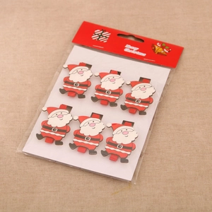 Detail view of six Santa Claus wooden clips in retail packaging for photo display