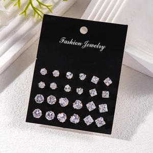 Set of 12 pairs of sparkling round, heart, and square zircon stud earrings on display card