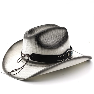 Detail of silver western straw cowboy hat with black leather band and silver metal studs
